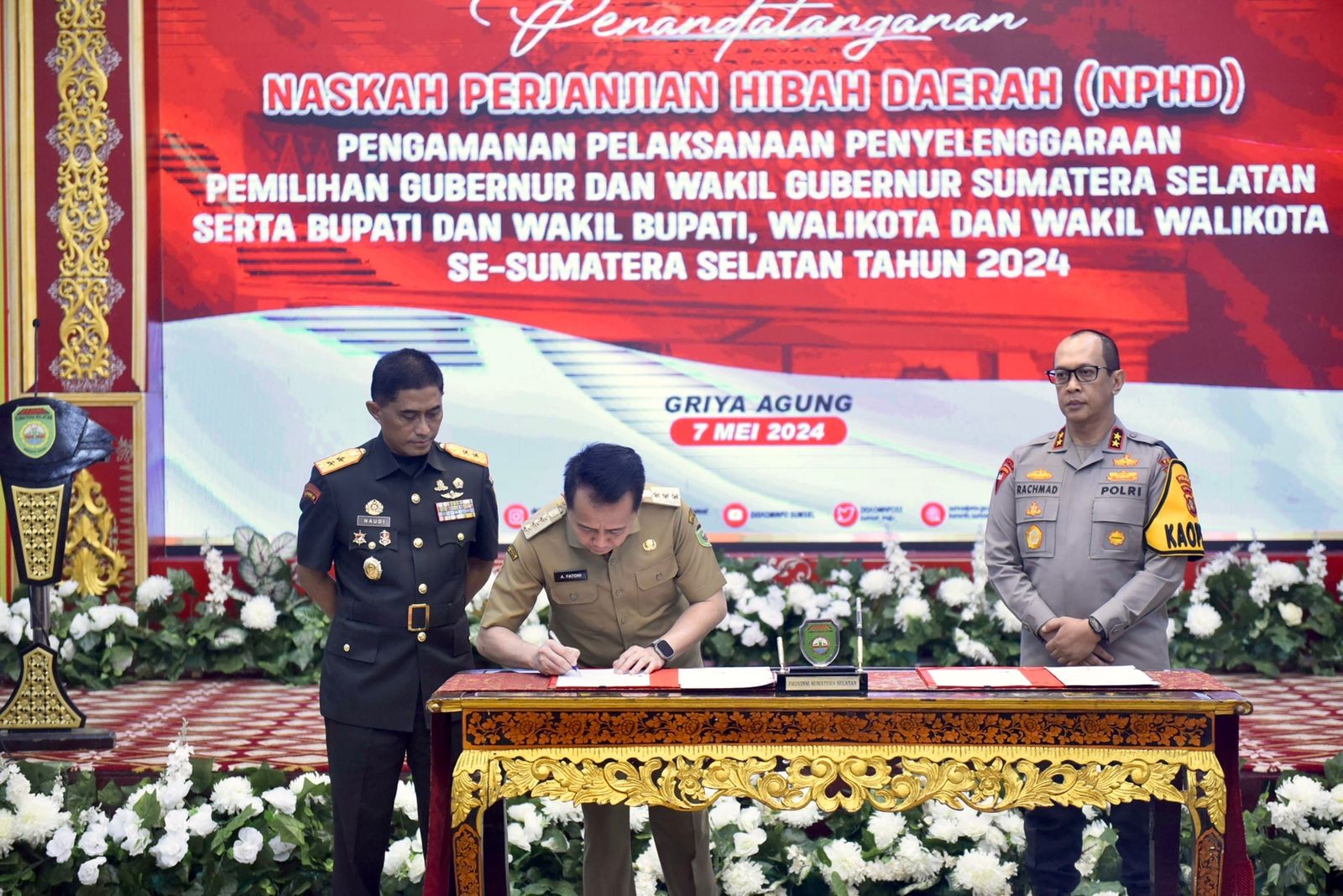 Pj Gubernur Sumsel Agus Fatoni Tanda Tangani NPHD Pengamanan Pilkada 2024  (FOTO:Dok Ist)
