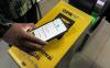 QRIS TAP, inovasi sistem pembayaran digital berbasis teknologi NFC dari BI mencatat capaian positif dalam satu bulan pertamanya. (Foto: iNews Media Group)