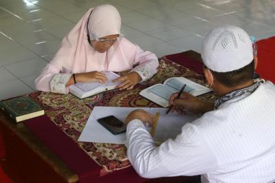 Uji Kompetensi atau Munaqosah Tartil Alquran Tingkat Pesantren Ilmu Alquran (PIQ) di Sekolah Khadijah Wonokromo Surabaya, Jawa Timur, Minggu (13/6/2021).