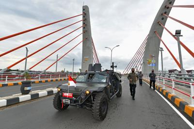 Presiden Joko Widodo saat meresmikan Jembatan Sei Alalak di Banjarmasin, Kalimantan Selatan, Kamis (21/10/2021).