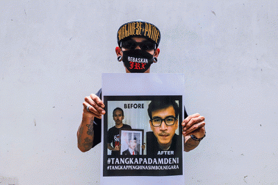 Sejumlah penggemar musisi Jerinx SID dan band Superman Is Dead (SID), Outsider menggelar aksi solidaritas.