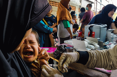 Antusias para ibu datang ke posyandu untuk mengecek kesehatan anaknya dalam perkembangan dan pertumbungan sang anak di Jakarta Selatan, Senin (15/8/2022).