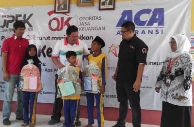 Komunitas wartawan JPEK didukung OJK menggandeng Industri Keuangan non bank menggelar CSR dalam rangka meningkatkan literasi keuangan bagi siswa Sekolah Dasar.