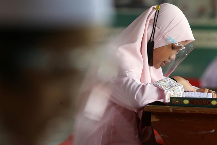 Uji Kompetensi atau Munaqosah Tartil Alquran Tingkat Pesantren Ilmu Alquran (PIQ) di Sekolah Khadijah Wonokromo Surabaya, Jawa Timur, Minggu (13/6/2021).