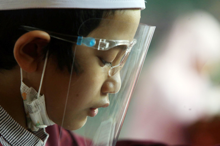 Uji Kompetensi atau Munaqosah Tartil Alquran Tingkat Pesantren Ilmu Alquran (PIQ) di Sekolah Khadijah Wonokromo Surabaya, Jawa Timur, Minggu (13/6/2021).