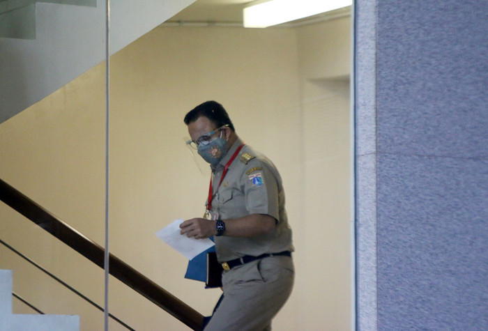 Gubernur DKI Jakarta Anies Baswedan saat tiba di Gedung Merah Putih, Kuningan, Jakarta, Selasa (21/9/2021).