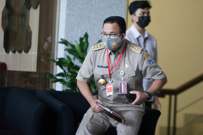 Gubernur DKI Jakarta Anies Baswedan saat tiba di Gedung Merah Putih, Kuningan, Jakarta, Selasa (21/9/2021).