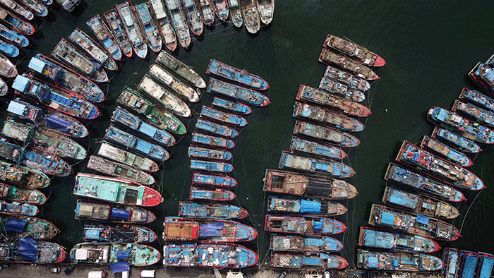 Foto udara puluhan kapal ikan bersandar di Pelabuhan Ikan Muara Baru, Jakarta Utara, Kamis (9/2/2023).